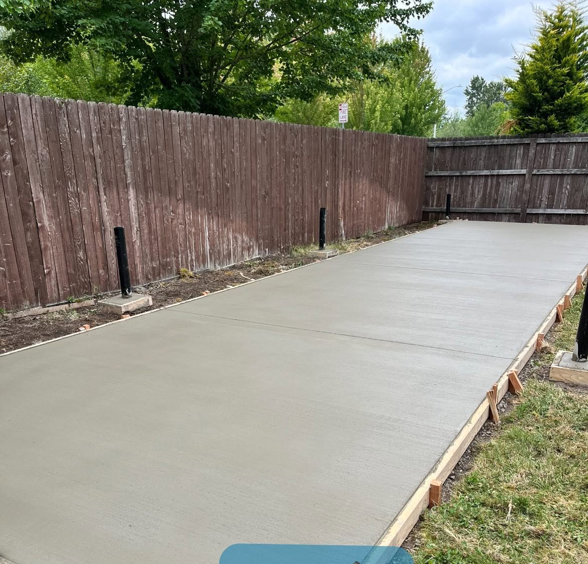 Freshly finished concrete slab with clean edges and formed perimeter