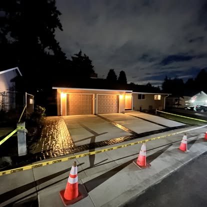Finished driveway and decorative concrete viewed at night